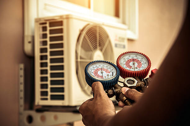Professional Air Conditioning Service technician working in Byron, CA